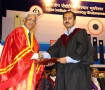 Director hands over the first Ph.D. degree